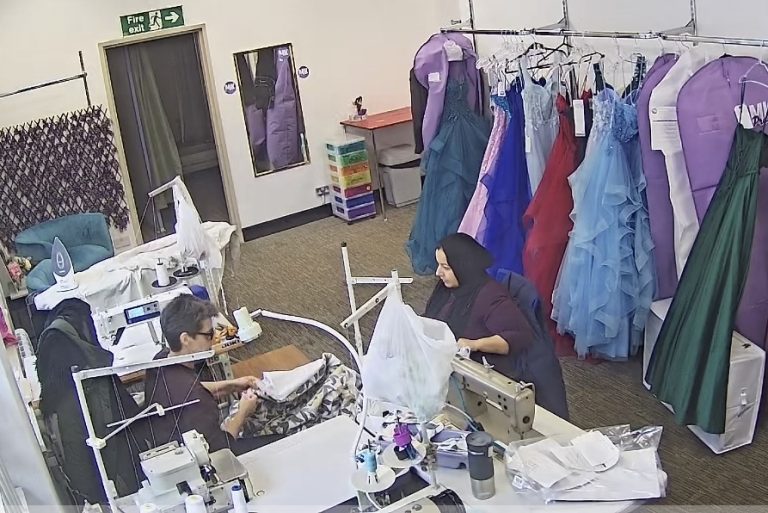 MK Seamstress team working in the Bletchley sewing studio with curtain alterations and evening dresses.